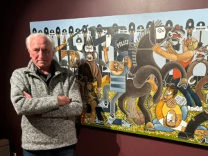Artist Robert Olley with oil on canvas 'Orgreave after Guernica'